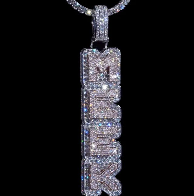 Vertical diamond name pendant on a black background